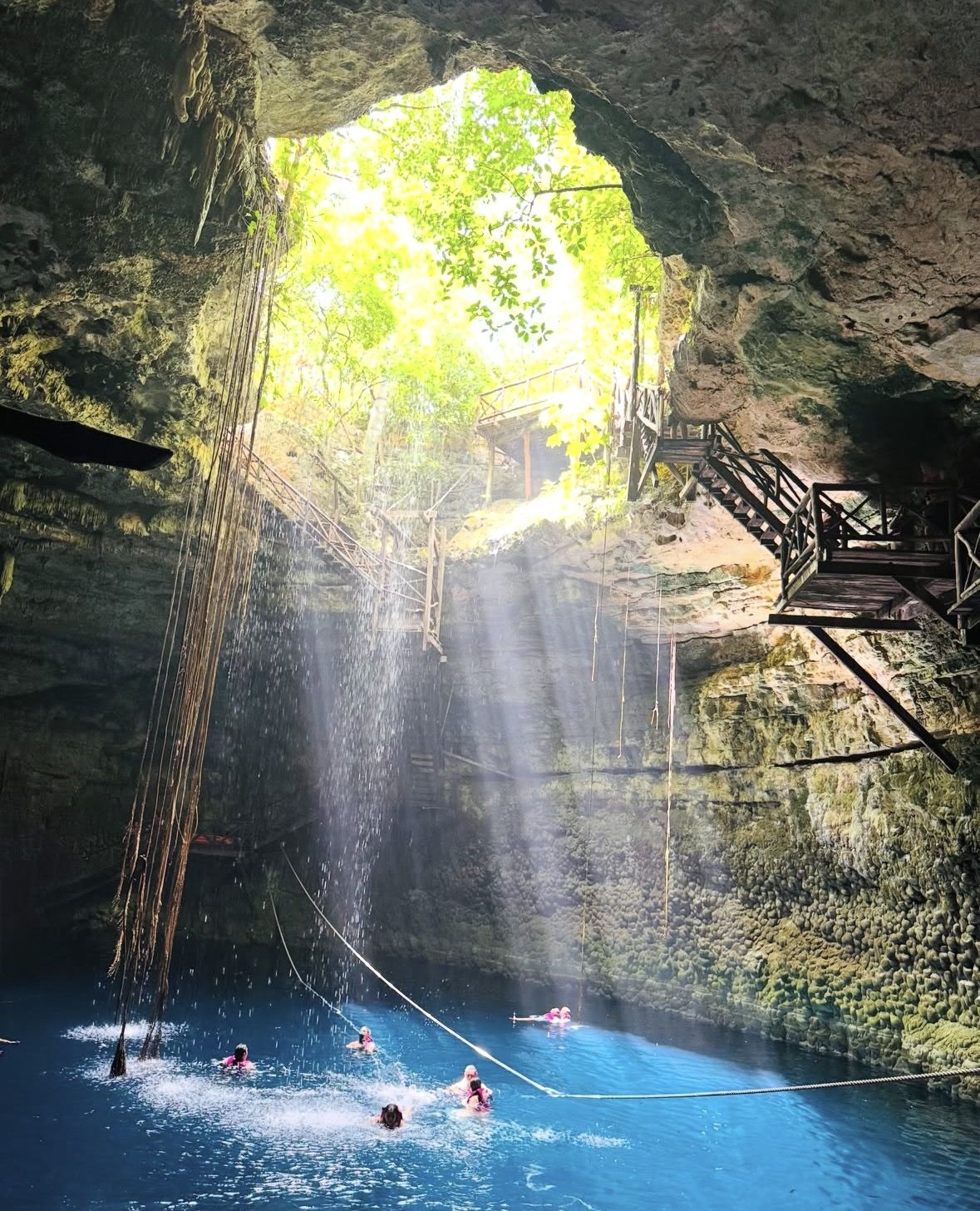 Snorkeling gear, biodegradable sunscreen, and dry bag laid out for a Yucatán swimming trip